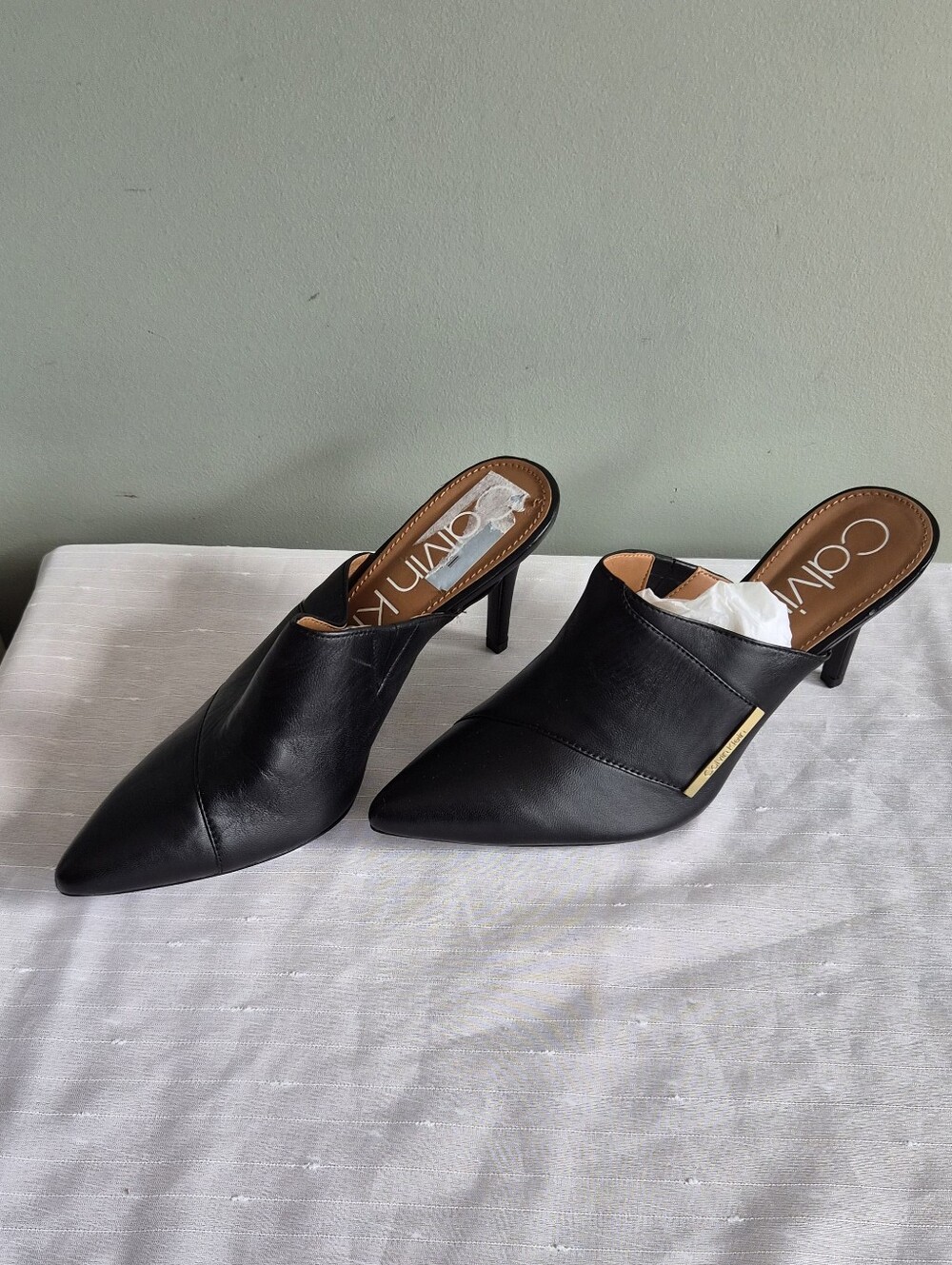 Calvin Klein Black Pointed Leather Slip-On Mules with Gold Accent